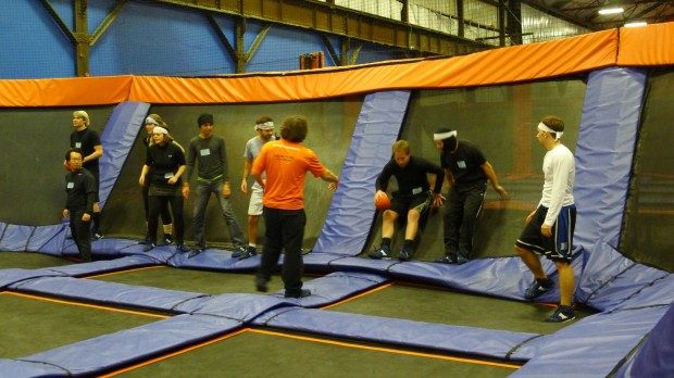 Dimagi team members mid-game on the trampoline court at the 2012 all-hands retreat