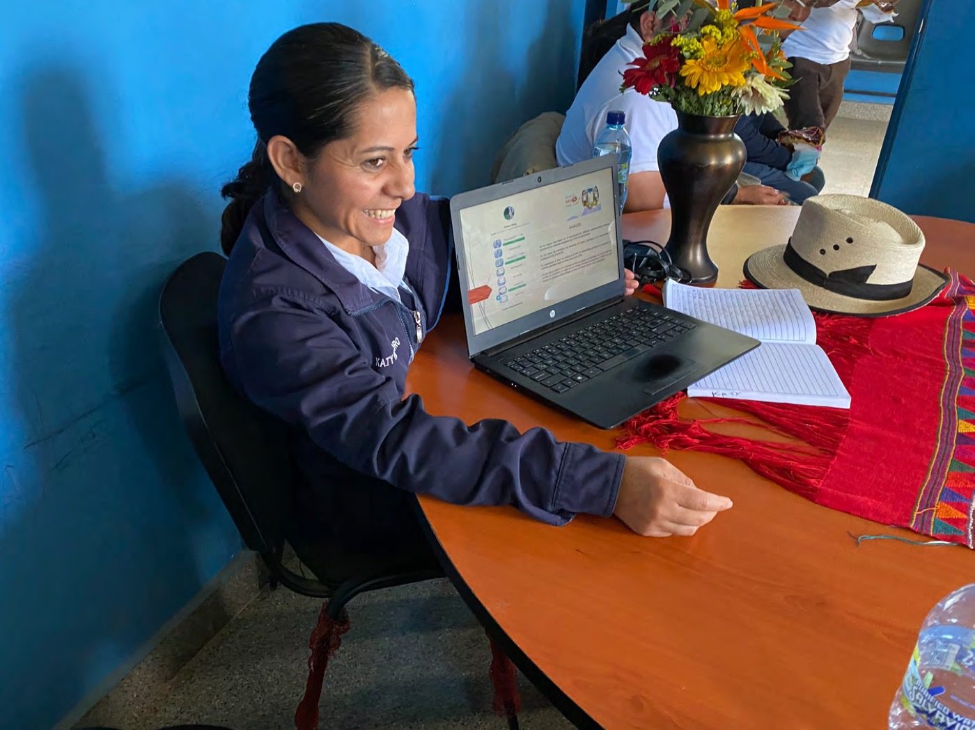 A TulaSalud nurse reviewing data on a laptop in rural Guatemala