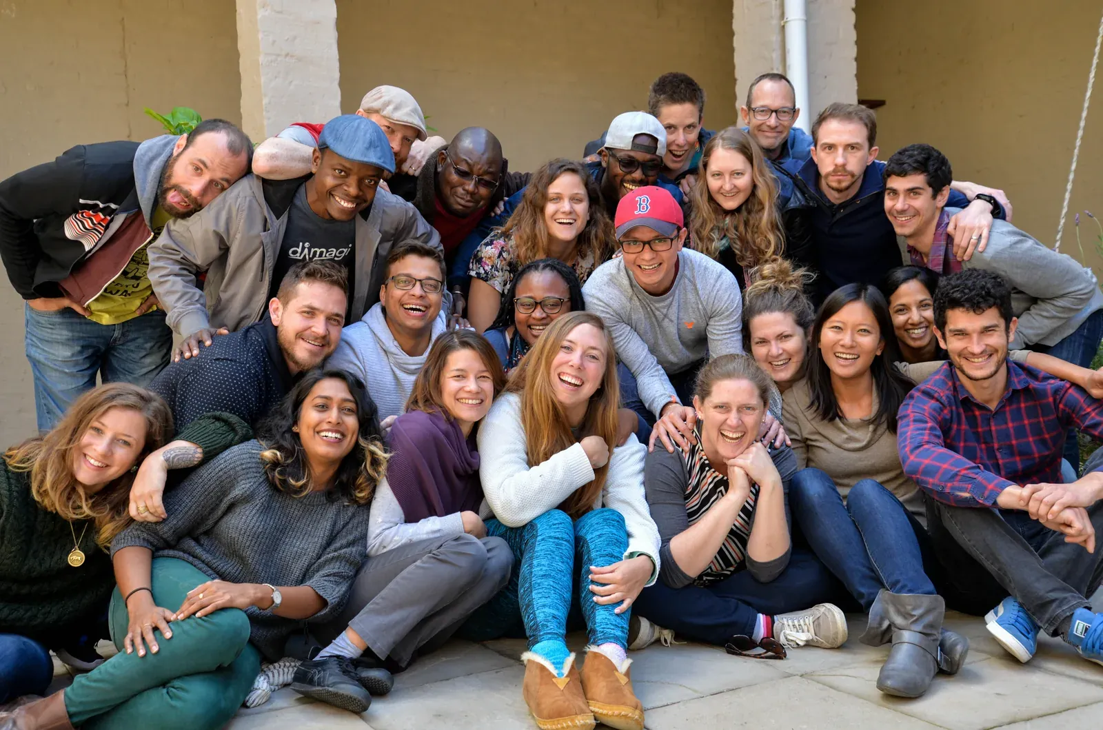 A large group photo of the Dimagi team posing together