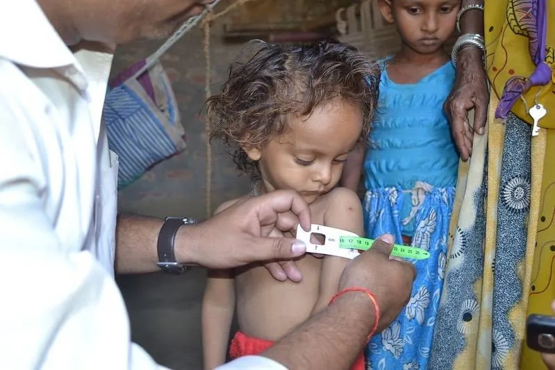 A child receiving care during a health campaign
