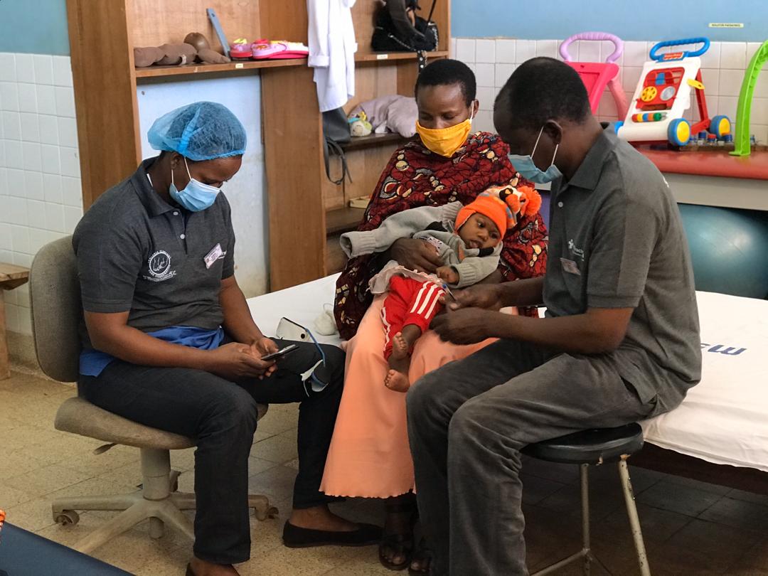 Image of health professionals and families wearing masks during COVID-19